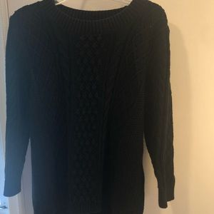 Women’s black cable knit sweater